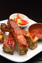 Barbecue pork ribs grilled on a white plate