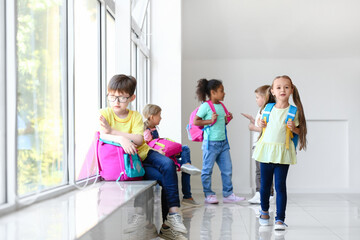 Little pupils in school hall