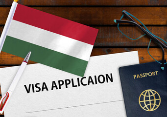 Flag of Hungary, visa application form and passport on table