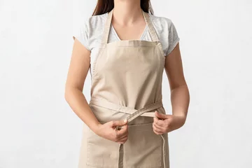 Fotobehang Female waiter wearing apron on white background © Pixel-Shot