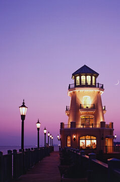 Fototapeta Lighthouse and pier in the sea, Beau Rivage, Biloxi, Harrison County, Mississippi, USA