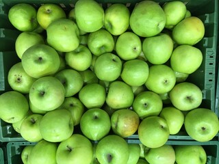 Green apples in market place