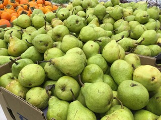Green pears in market place