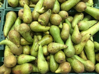 Long green pears in market place