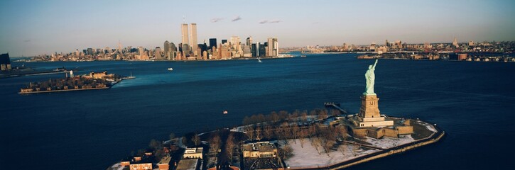 High angle view of Ellis Island with the Statue of Liberty and the World Trade Center in Manhattan, New York City, New York State, USA
