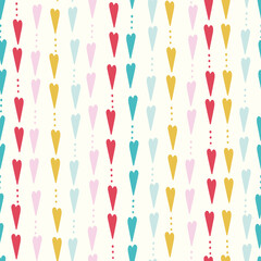 Heart pattern design, cute vector seamless repeat of hand drawn colourful hearts ideal for Valentines day.