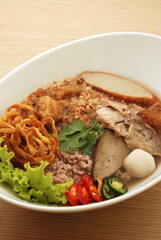 spicy noodles with fish ball and minced pork (Tom Yum Noodles) - Asian food style