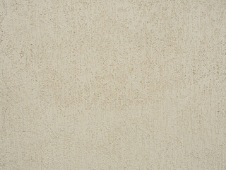 Beige wall with decorative plaster with patterned scratches. Texture not seamless
