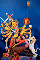 Idol of Goddess Devi Durga at a decorated puja pandal in Kolkata, West Bengal, India. Durga Puja is...
