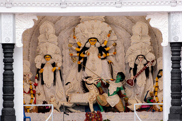 Idol of Goddess Devi Durga at a decorated puja pandal in Kolkata, West Bengal, India. Durga Puja is...