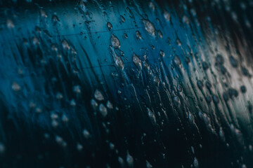 Glass washing. Wet glass. Close-up of foam dripping on wet glass