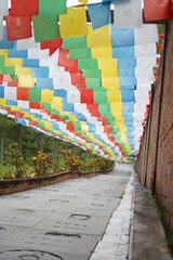 a long stairs with full of colour paper upside