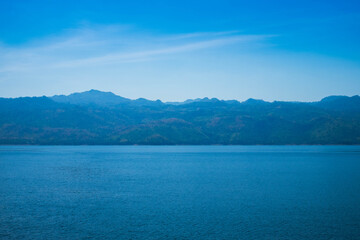 Beautiful scenery view of blue sky mountain lake.  Summer, landscape nature of green tree and rock in forest tranquility. Nature tourism and parks outdoor concept