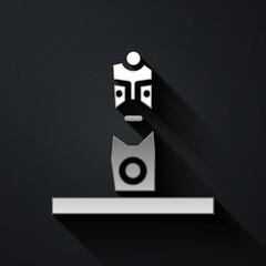 Silver Slavic pagan idol icon isolated on black background. Antique ritual wooden idol. Long shadow style. Vector.