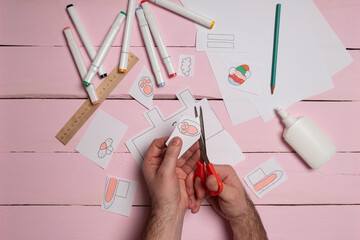 Step 6. DIY Children's Easter craft bunny with an egg. Easter craft paper step by step instructions...