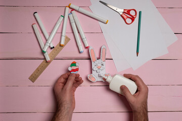Step 11. DIY Children's Easter craft bunny with an egg. Easter craft paper step by step...