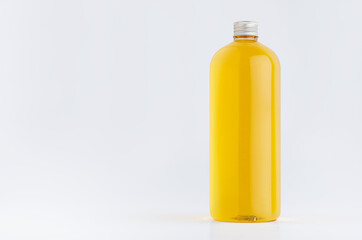 Transparent plastic tall bottle with orange drink, cooking oil or cosmetic produce, silver cap mockup on white background. Template for portfolio, design, branding identity.