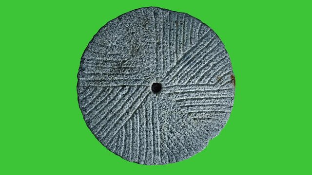 first millstone down side move or cause to move in a circle around an axis or center. Isolated on green background.
