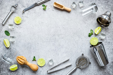 Frame of bar utensils and tools for Mojito cocktail - shaker, lime and ice