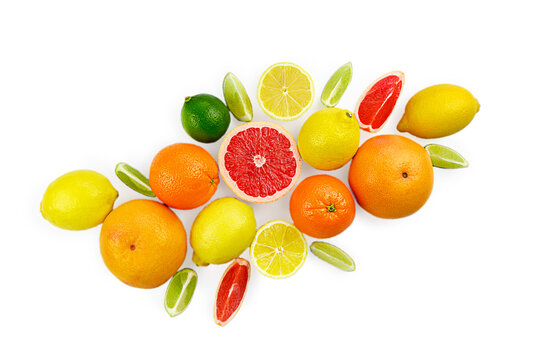 Flat lay composition with citrus fruits, leaves and flowers isolated on white background © Gita