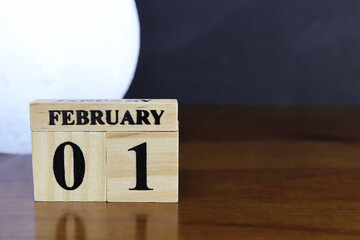 Day 1 of february month, Wooden calendar with date. Empty space for text.