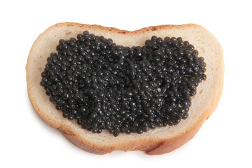 Red caviar lies on bread. Isolated object on a white background