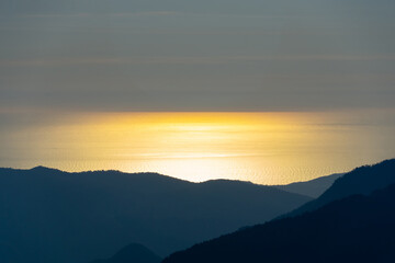 sunset in the mountains over the sea