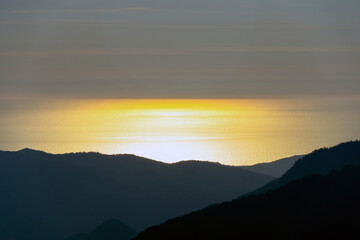 sunset in the mountains over the sea