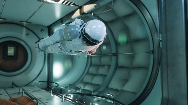 An astronaut in zero gravity checks the module of his spaceship. The animation is for fantastic, the futuristic or space travel backgrounds.