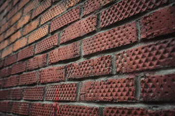 Old brick wall close up. Rhombus patterned brick.