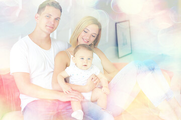 baby with parents in a cozy house / healthy young family mom dad and baby, happiness smile