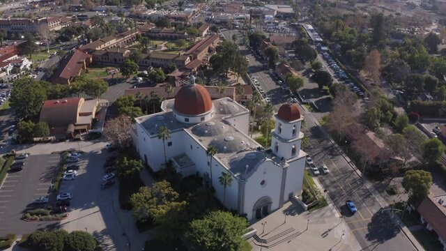 Daytime aerial view of the Spanish Colonial era mission and surrounding city of downtown San Juan Capistrano, California, USA. 