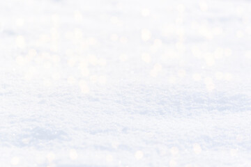 Background texture of white snow sparkling in sun