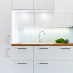 White kitchen with wooden countertop