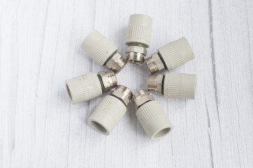 Combined couplings for connecting metal and polypropylene water pipes