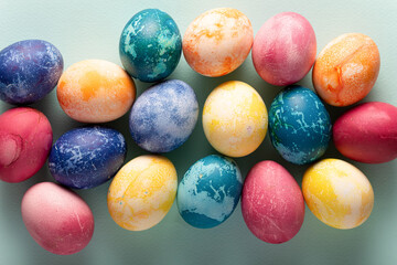 Easter eggs on blue background, top view