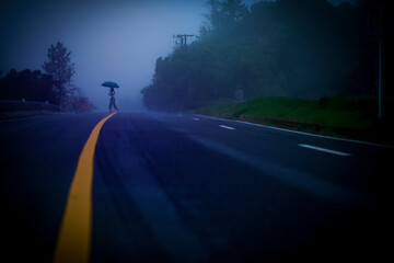 woman on foggy mountain road