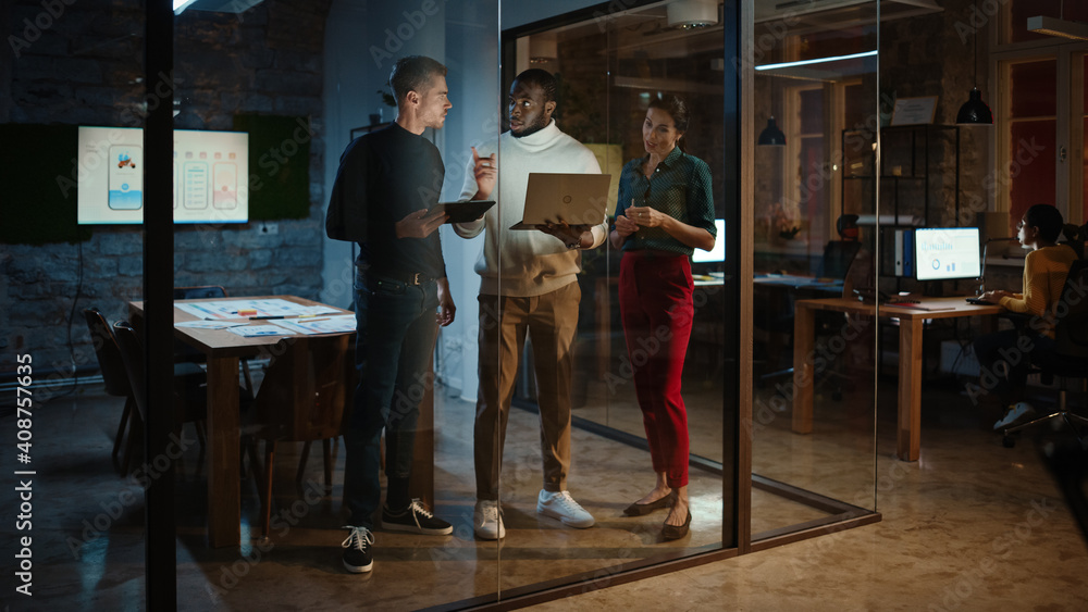 Aufkleber Diverse Multiethnic Team are Having a Conversation in a Meeting Room Behind Glass Walls in an Office. Black Creative Director Talks to Project Managers About the Work and Shows Brief on Laptop.