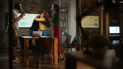 Successful Diverse Multiethnic Team are Celebrating Great Business Results, Clapping Hands in a Meeting Room Behind Glass Walls in a Creative Office. Agency Colleagues Won an App Design Project.