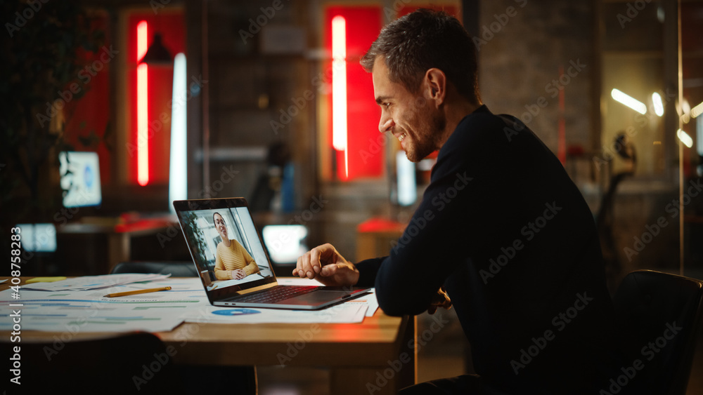 Aufkleber Handsome Caucasian Project Manager is Making a Video Call on Laptop Computer in a Creative Office Environment. Male Specialist Talking to a Multiethnic Latina Colleague Over a Live Camera.