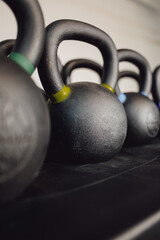 Obraz na płótnie Canvas Kettlebell in the gym for sports. Iron for muscle training.