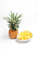 Honey pineapple fruit (Nanas Madu) with the Latin name Ananas Comosus on white background. isolated