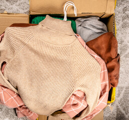 Clothes for clothing swap. Concept of waste problem in fashion industry.