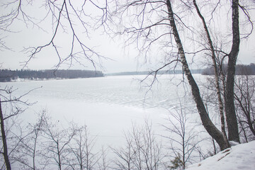 Fototapeta na wymiar Frozen pond in cold winter day