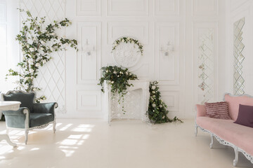 luxury delicate interior of the living room and bedroom in light colors with expensive chic carved furniture in classic style