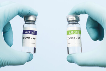 two different Coronavirus vaccine, vaccine race. on a blue background. copy space, banner