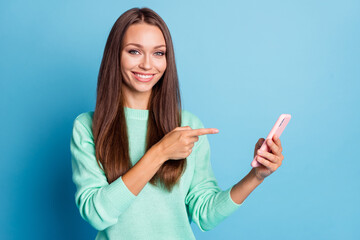 Portrait of attractive cheery brown-haired girl using demonstrating device 5g app post like isolated on bright blue color background