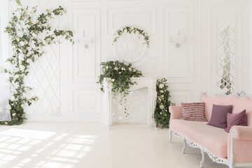 luxury delicate interior of the living room and bedroom in light colors with expensive chic carved furniture in classic style