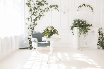 luxury delicate interior of the living room and bedroom in light colors with expensive chic carved furniture in classic style
