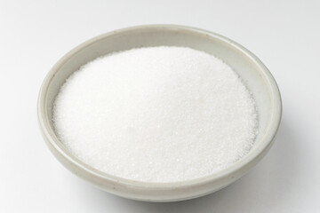 White sugar on white background